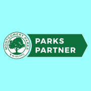 Montgomery Parks & Planning Partner Logo with large tree in the center of a cirle with the abbreveiation M-NPC for the Maryland-National Capital Parks & Planning Commission.